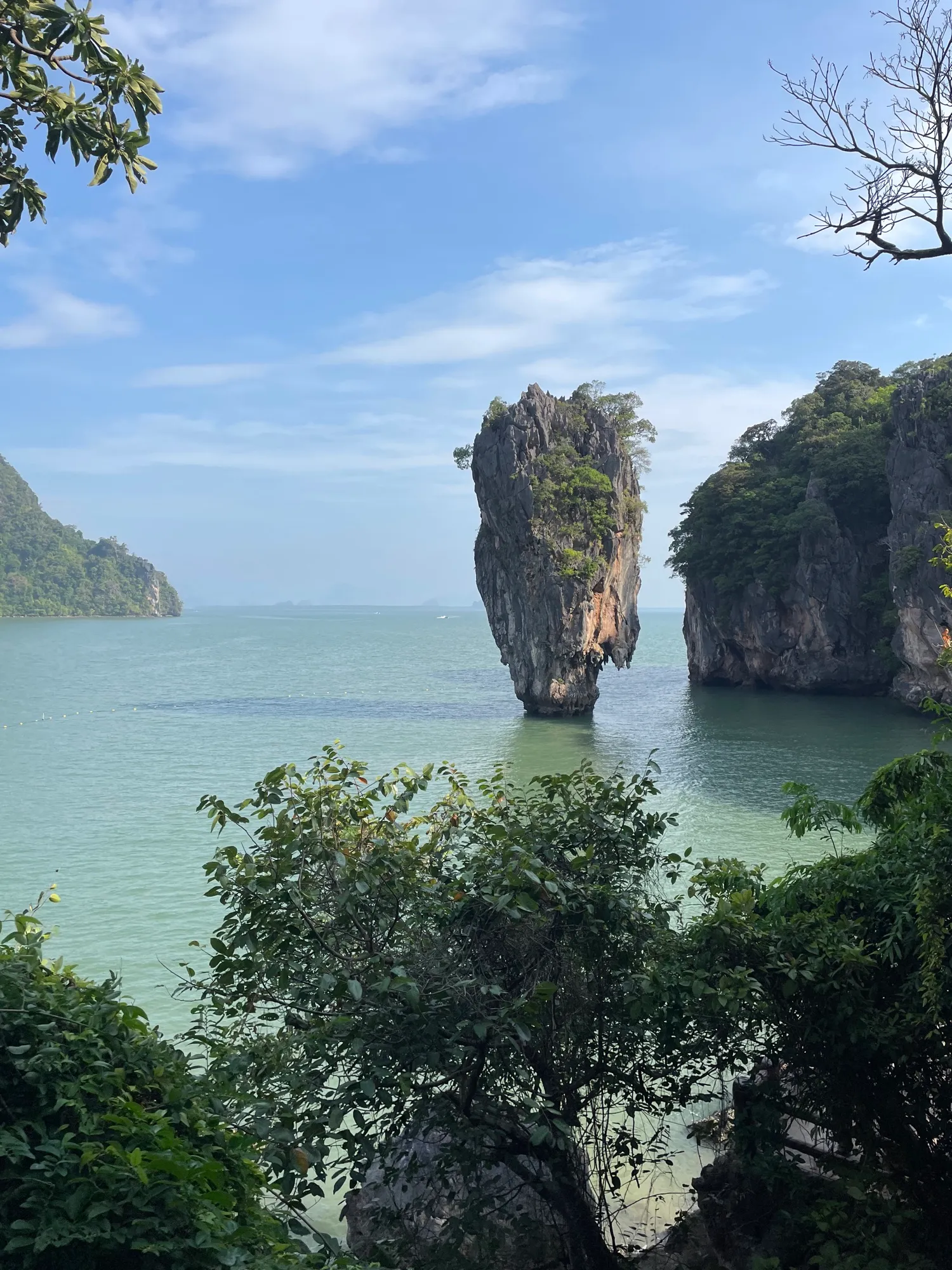 The karst islet of Ko Ta Pu, rising from the bay and surrounded by emerald waters